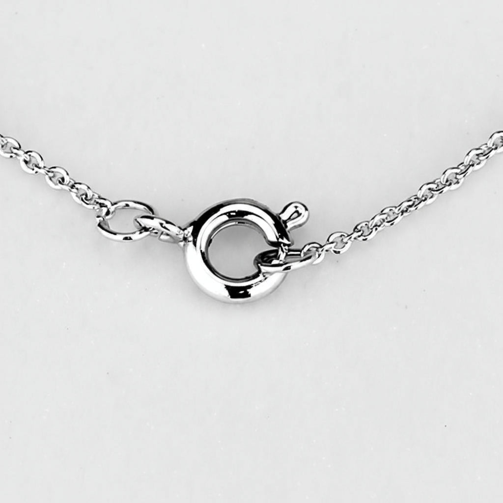 Silver necklace clasp on a light gray background
