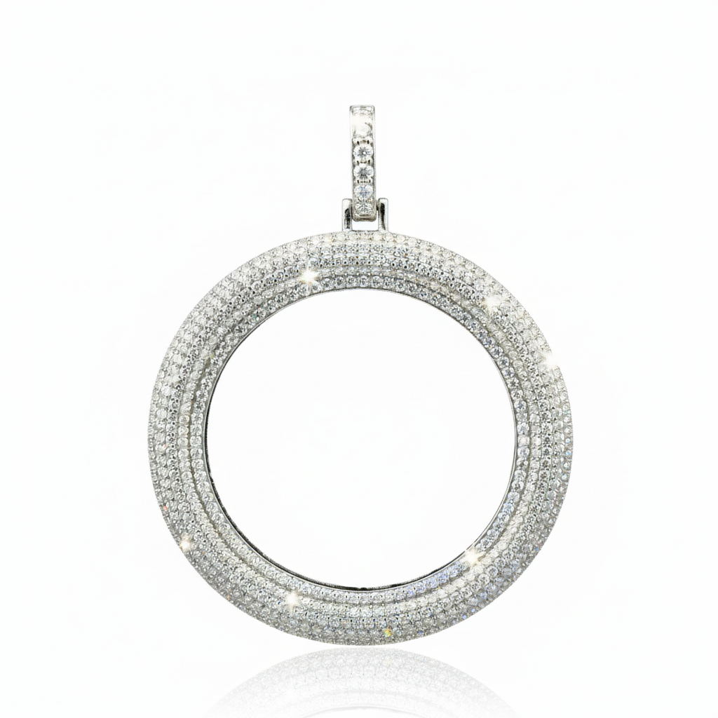 Silver circular pendant with multiple rows of diamonds on a white background