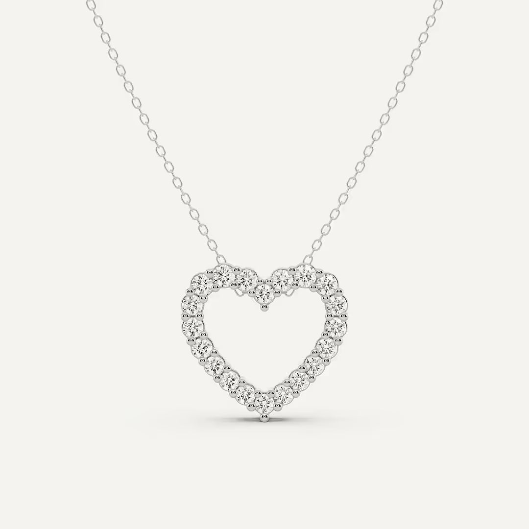 Heart-shaped diamond necklace on a white background