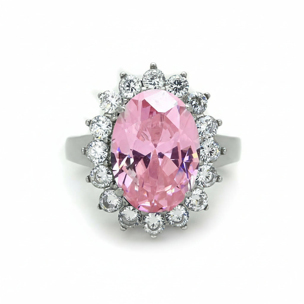 Ring with a pink gemstone and clear stones, showing measurements on a white background.