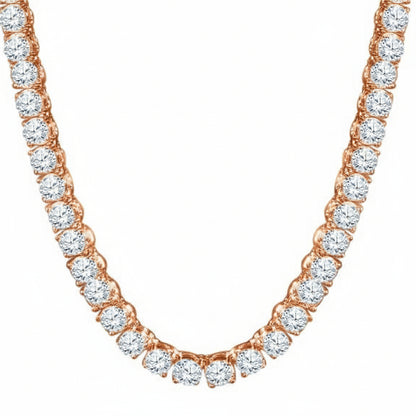 Rose gold necklace with clear gemstones on a white background