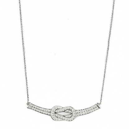 Silver necklace with a knot design on a white background