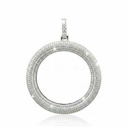 Silver circular pendant with multiple rows of diamonds on a white background