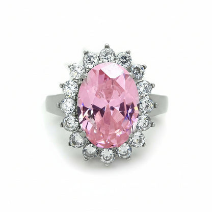 Ring with a pink gemstone and clear stones, showing measurements on a white background.