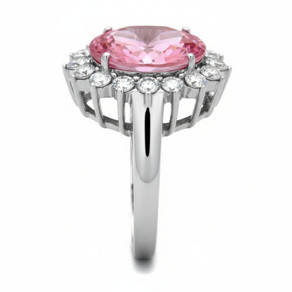 Ring with pink gemstone and diamond-like stones on a white background