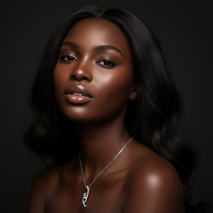 Silver necklace with a diamond pendant on a white background