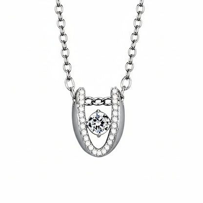 Silver horseshoe pendant with central gemstone and measurements on a white background