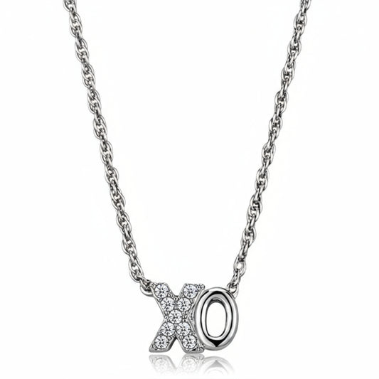 Silver necklace with 'X' and 'O' pendant on a white background