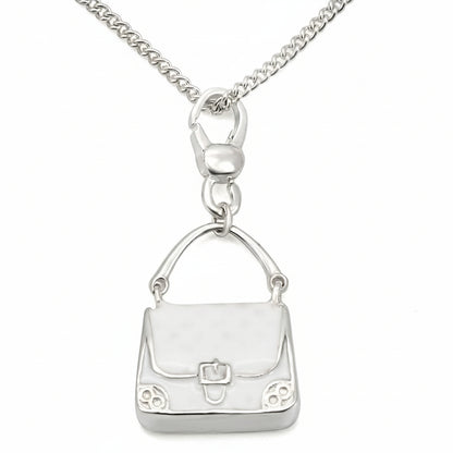 Silver handbag pendant on a chain against a white background