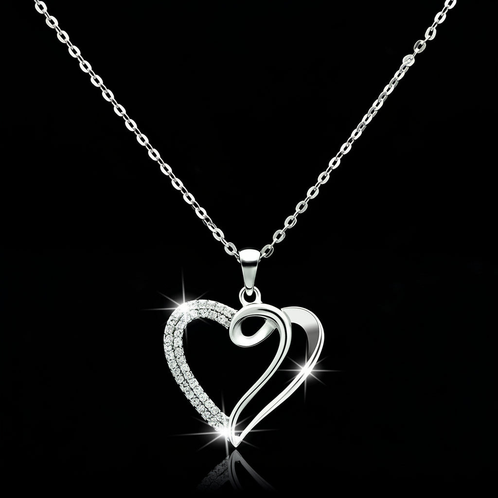 Silver heart-shaped pendant necklace on a black background