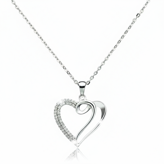 Silver heart-shaped pendant necklace on a white background