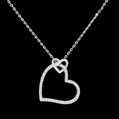 Heart-shaped diamond necklace on a black background